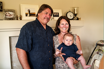 Grandpa Joe and Grandma Bev holding Michael